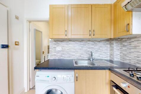 Bright and functional kitchen with wooden cabin...