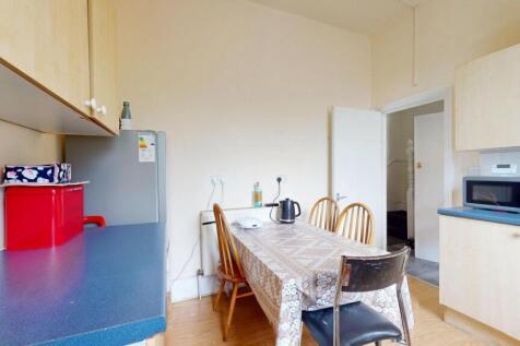Bright and tidy kitchen featuring ample counter...