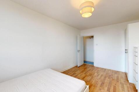 Bright, simply styled double bedroom with fresh...