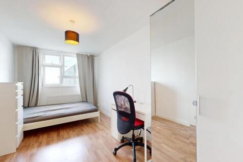 Bright, minimalist bedroom with large window, n...