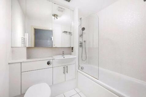 Bright and modern bathroom featuring a clean wh...