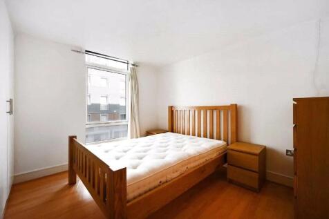 A bright and tidy double bedroom featuring a wo...
