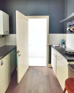 A neat and functional kitchen space featuring c...