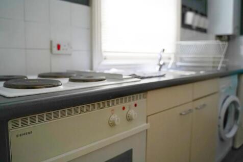 Bright and functional kitchen space featuring a...