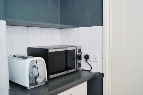 A tidy kitchen corner featuring a sleek black m...