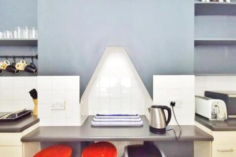 Bright and tidy kitchen area featuring a modern...