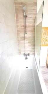 Bright and modern bathroom suite featuring a cl...