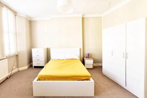 Bright and spacious double bedroom featuring a ...