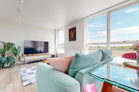 Bright contemporary living room with large wind...