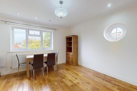 Bright, well-lit reception room with large fron...