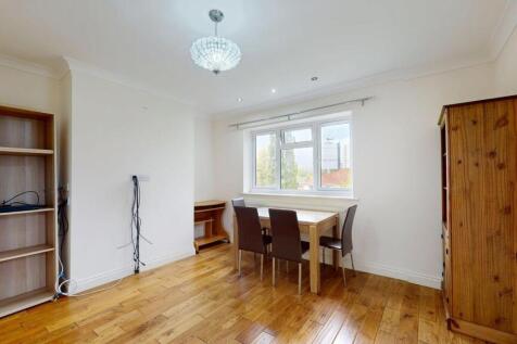 Bright, neutrally decorated living/dining room ...