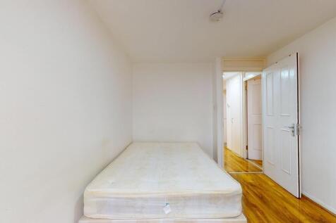 Simple, clean bedroom with a mattress ready for...