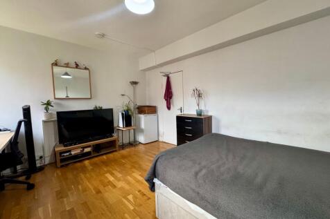 Bright, neatly presented bedroom with wooden fl...