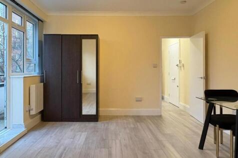 Bright, neatly presented bedroom with large win...