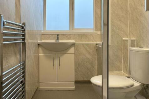 Modern, well-kept bathroom with a vanity sink, ...