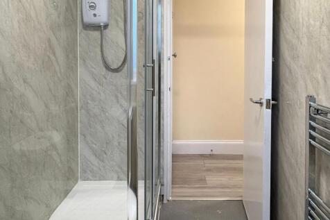 Modern bathroom with a walk-in shower enclosure...