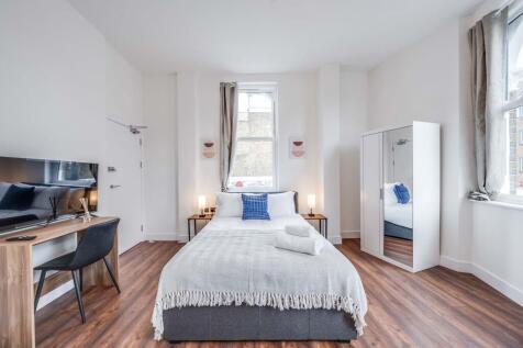 Bright and inviting double bedroom featuring a ...