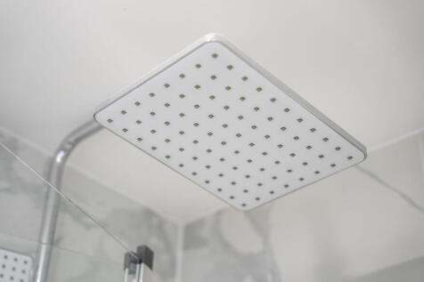Close-up view of a modern square rain shower he...