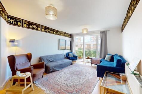 A bright and inviting living room featuring com...