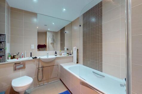 A modern and well-maintained bathroom suite fea...