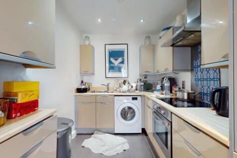 A modern, well-equipped kitchen featuring ample...