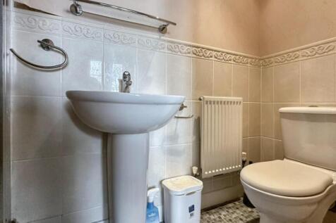 A clean and well-maintained bathroom featuring ...