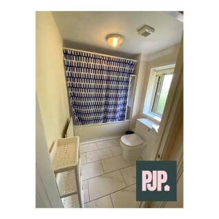 A bright and clean bathroom featuring modern fi...