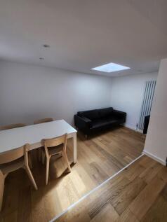 A modern living room featuring a sleek black le...