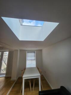 Bright and modern communal lounge featuring a l...