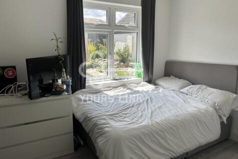 A bright and inviting double bedroom with ample...