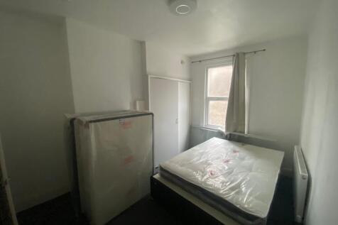 A cozy double bedroom featuring a new mattress ...