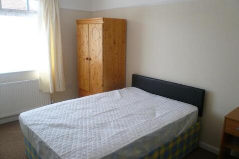 A bright and welcoming double bedroom with ampl...