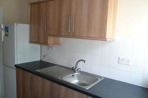 A tidy and functional kitchenette featuring amp...