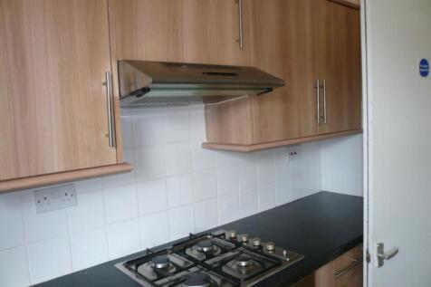 A tidy and modern kitchenette featuring ample s...