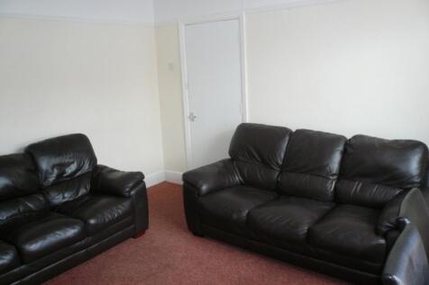 A spacious and inviting living room featuring c...