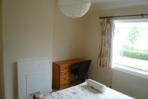 A bright and inviting double bedroom featuring ...