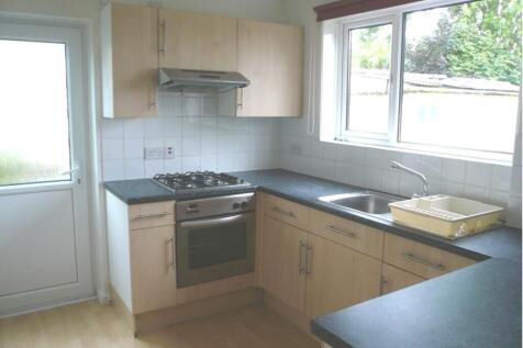A bright and tidy kitchenette featuring modern ...