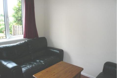 A cozy living room with ample natural light and...