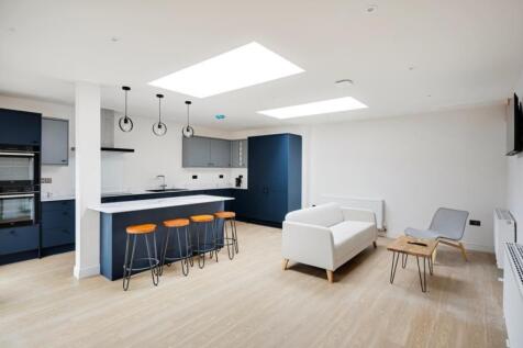 A modern kitchen with a spacious layout and goo...