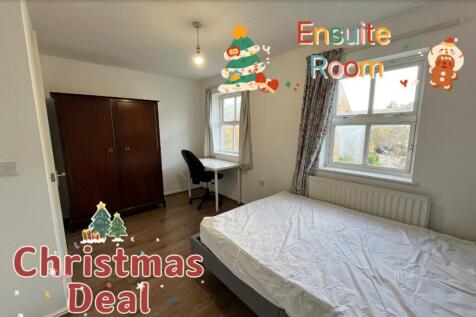 A bright and inviting double bedroom featuring ...