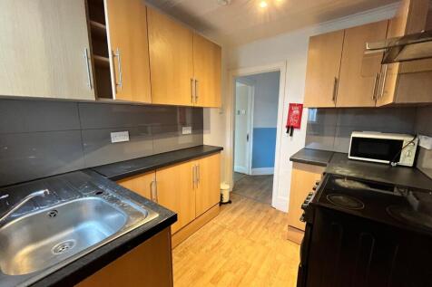 A bright and tidy kitchenette featuring modern ...