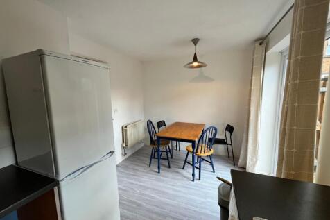A bright and tidy kitchenette with ample space ...
