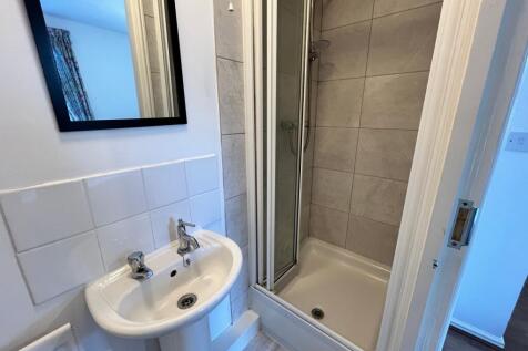 A modern and tidy bathroom featuring a stylish ...