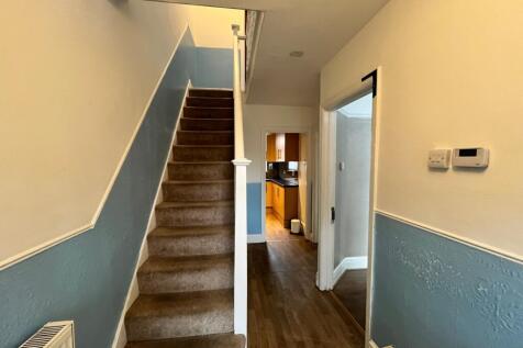 A well-maintained staircase with natural light,...