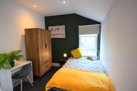 A bright and inviting double bedroom featuring ...