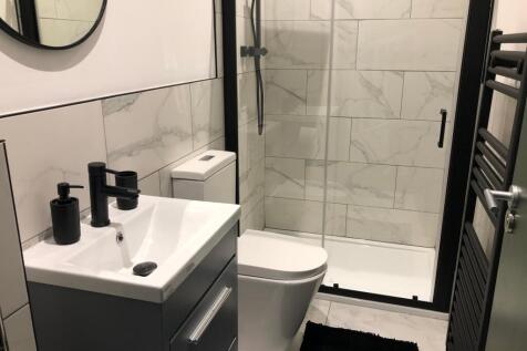 A modern and stylish bathroom featuring sleek f...