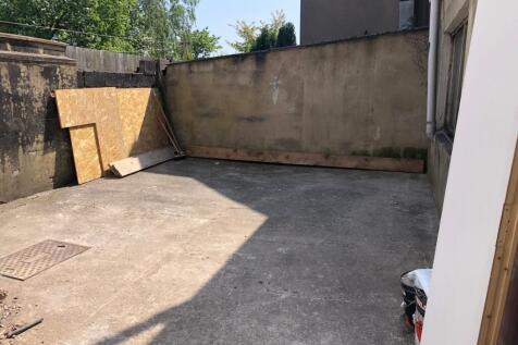 A spacious outdoor area with potential for cust...