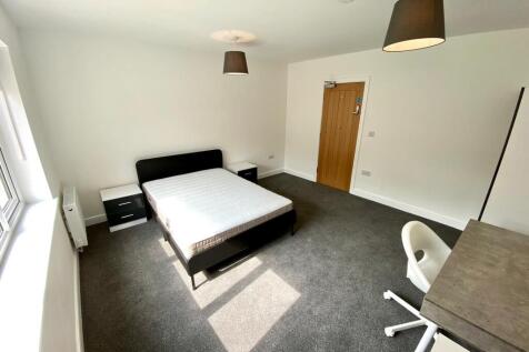 A spacious and bright double bedroom, perfect f...