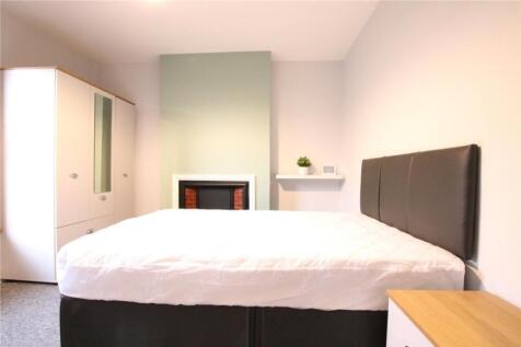 A spacious and inviting double bedroom featurin...