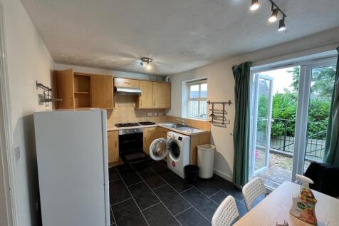 A modern and spacious kitchenette with ample st...
